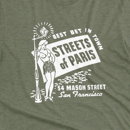 A green t-shirt with a vintage advertisement for 'STREETS OF PARIS', a bar in San Francisco.