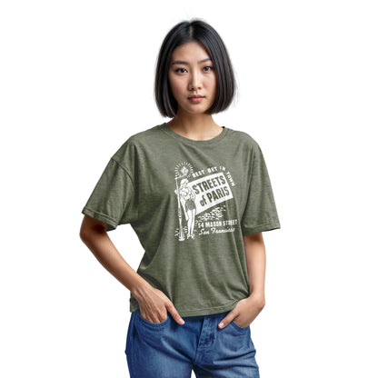 A green t-shirt with a vintage advertisement for 'STREETS OF PARIS', a bar in San Francisco.