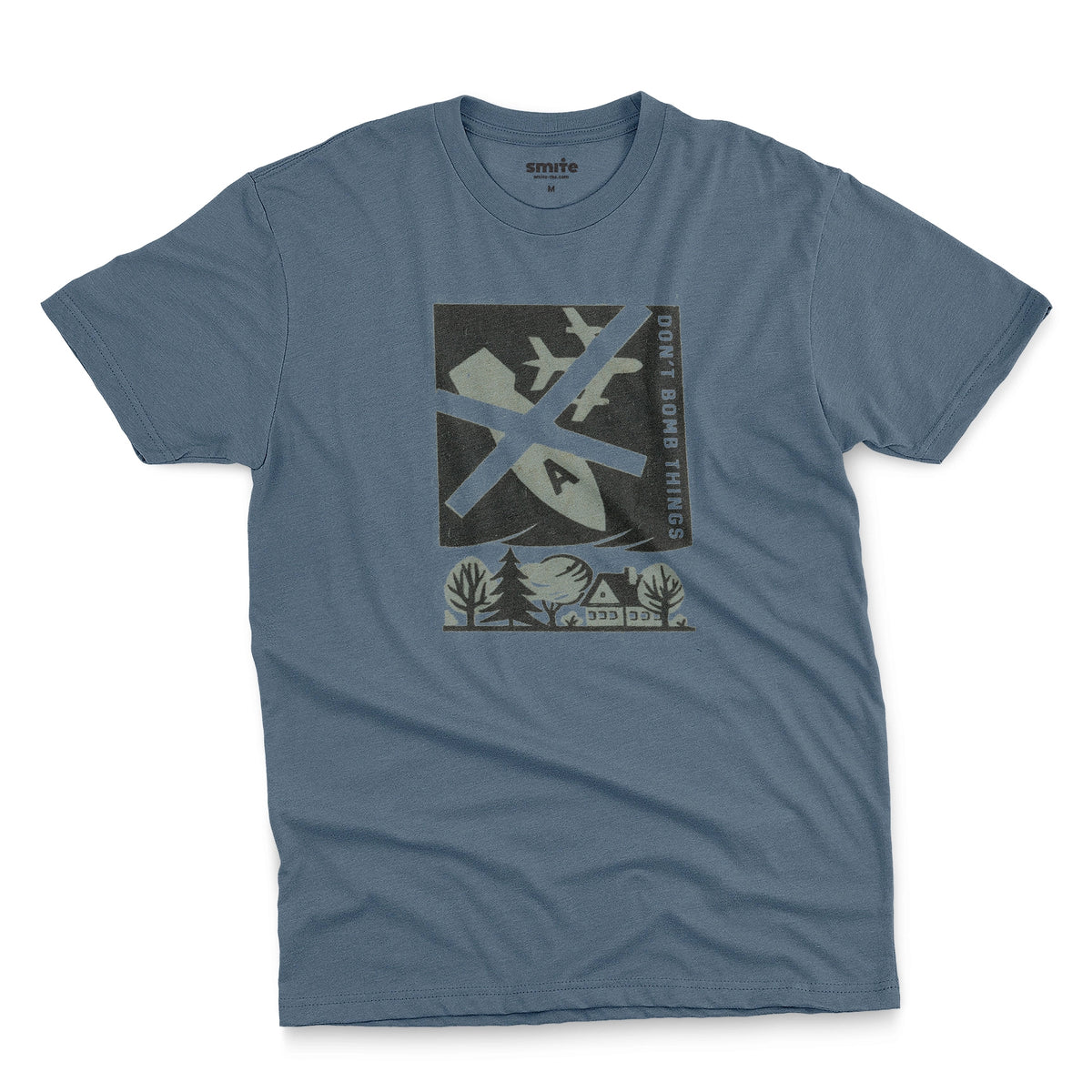 A blue t-shirt with a retro graphic print of an anti-war message featuring a cross, a plane, a house, and the text 'DON'T BOMB THINGS'.