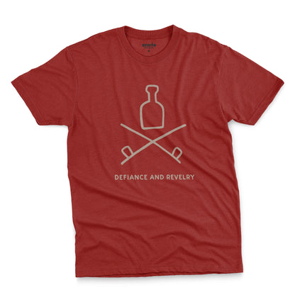 A red t-shirt with a grey graphic of a bottle and crossed smoking pipes beneath it and the words defiance and revelry. The graphic is from an 1800s Australian convict tattoo.