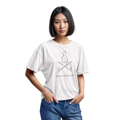 A white t-shirt with a grey graphic of a bottle and crossed smoking pipes beneath it and the words defiance and revelry. The graphic is from an 1800s Australian convict tattoo.