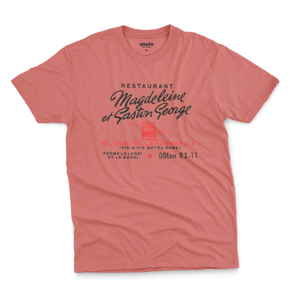 A coral pink t-shirt with a vintage advertisement for the 'Magdeleine et Gaston George' restaurant in Paris, France.