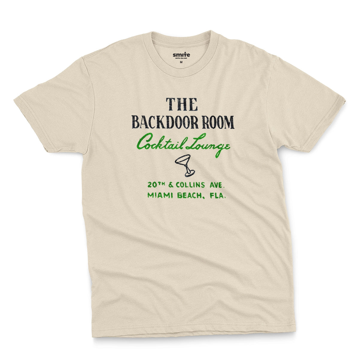 A beige t-shirt with a retro advertisement for 'THE BACKDOOR ROOM Cocktail Lounge' on Miami Beach, Florida.