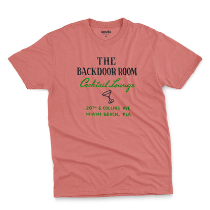 A coral pink t-shirt with a retro advertisement for 'THE BACKDOOR ROOM Cocktail Lounge' on Miami Beach, Florida.