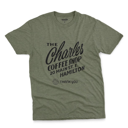 A green t-shirt with a retro typographic logo for The Charles Coffee Shop in Hamilton.