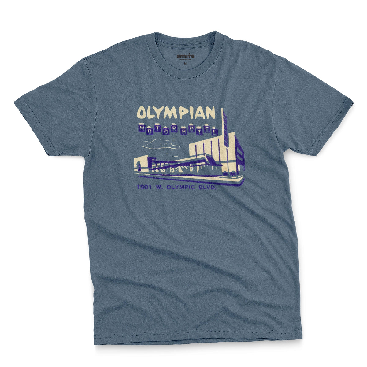 A blue t-shirt with a vintage advertisement for the Olympian Motor Hotel.