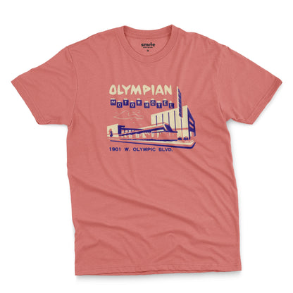 A coral pink t-shirt with a vintage advertisement for the Olympian Motor Hotel.