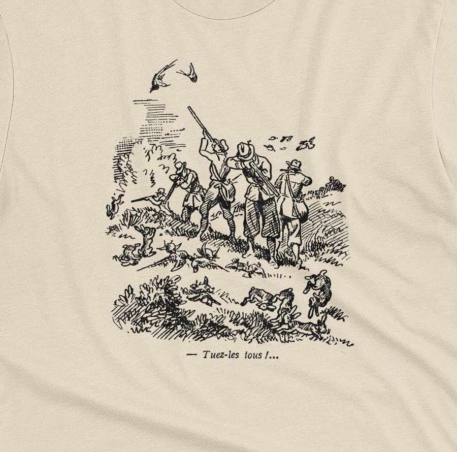 A beige t-shirt with a black vintage graphic print depicting a French hunting scene and the text 'Tuez-les tous!' or 'Kill them all' in English.