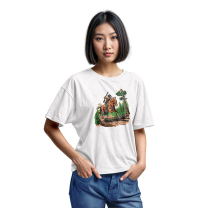 A white t-shirt featuring a 1960s vintage graphic print of a cowboy riding a horse through a forest.