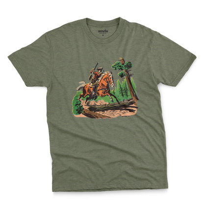 A green t-shirt featuring a 1960s vintage graphic print of a cowboy riding a horse through a forest.