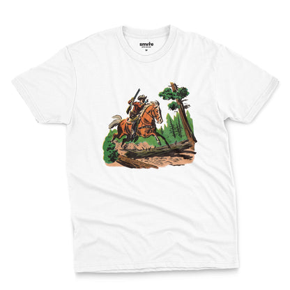A white t-shirt featuring a 1960s vintage graphic print of a cowboy riding a horse through a forest.