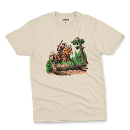 A beige t-shirt featuring a 1960s vintage graphic print of a cowboy riding a horse through a forest.