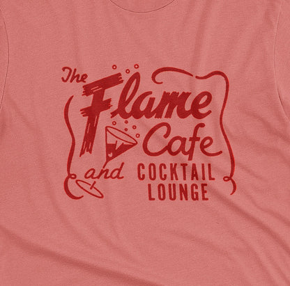 A coral pink t-shirt with an advertisement for 'The Flame Cafe and Cocktail Lounge' in Minneapolis.
