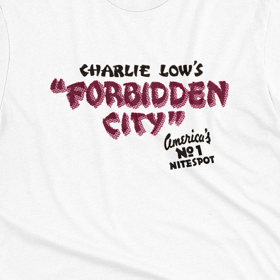 A white t-shirt with a retro advertisement for 'CHARLIE LOW'S FORBIDDEN CITY' nightclub.