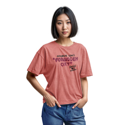 A coral pink t-shirt with a retro advertisement for 'CHARLIE LOW'S FORBIDDEN CITY' nightclub.