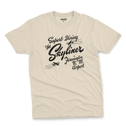A beige t-shirt with a retro advertisement for The Skyliner restaurant at the airport in Farmington, New Mexico.