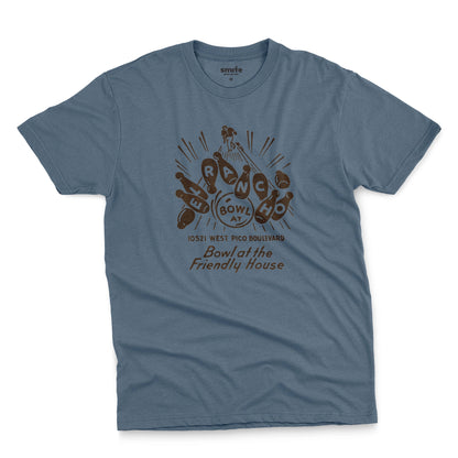 A blue t-shirt with a retro 1960s graphic advertisement for El Rancho bowling alley features bowling pins, bowling balls, and the text 'Bowl at the Friendly House' along with an illustration of a bowler.