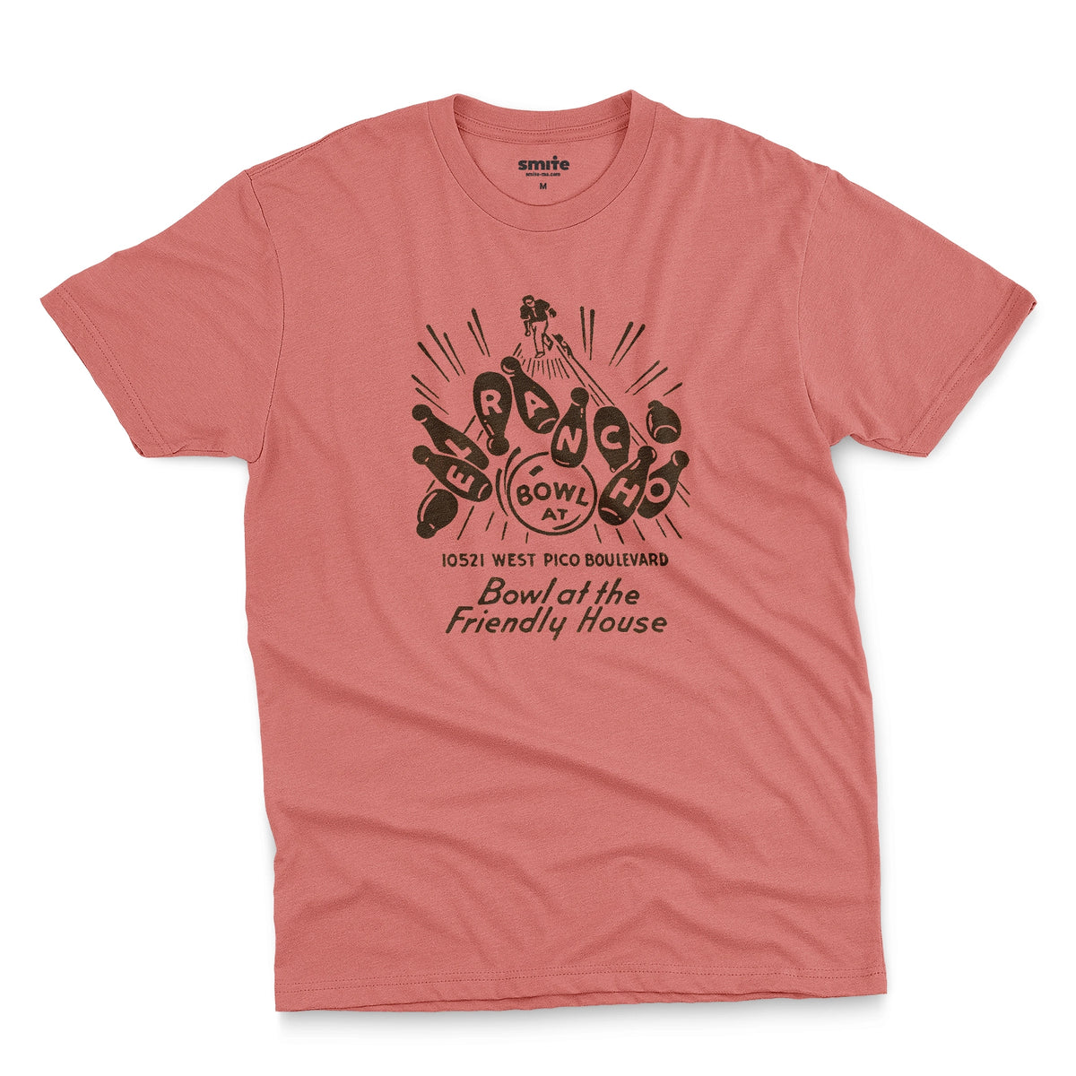 A coral pink t-shirt with a retro 1960s graphic advertisement for El Rancho bowling alley features bowling pins, bowling balls, and the text 'Bowl at the Friendly House' along with an illustration of a bowler.