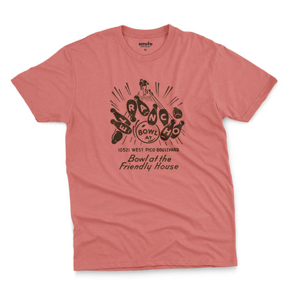 A coral pink t-shirt with a retro 1960s graphic advertisement for El Rancho bowling alley features bowling pins, bowling balls, and the text 'Bowl at the Friendly House' along with an illustration of a bowler.