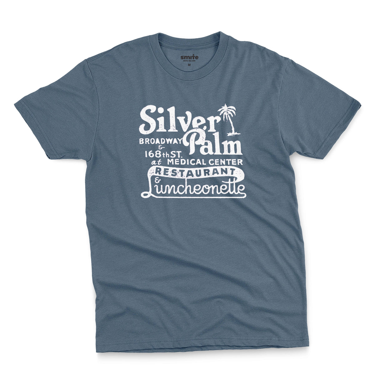 A blue t-shirt with a retro advertisement for Silver Palm Restaurant in New York.