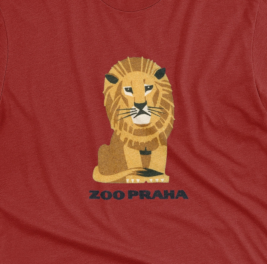A red t-shirt with a 1960s ad for Prague Zoo featuring a retro graphic of a resting lion with 'ZOO PRAHA' printed underneath.