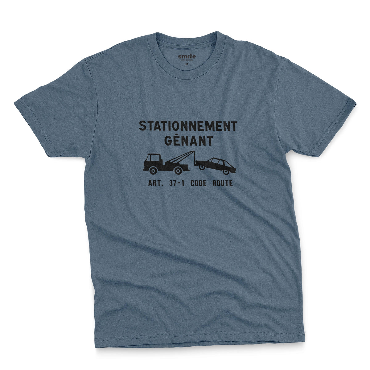 A blue t-shirt with a graphic print of a French street sign that says "nuisance parking" in French and a picture of a car being towed away.