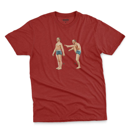 A red t-shirt featuring a 1960s vintage graphic of an exercising man in blue swim trunks, labeled A and B.