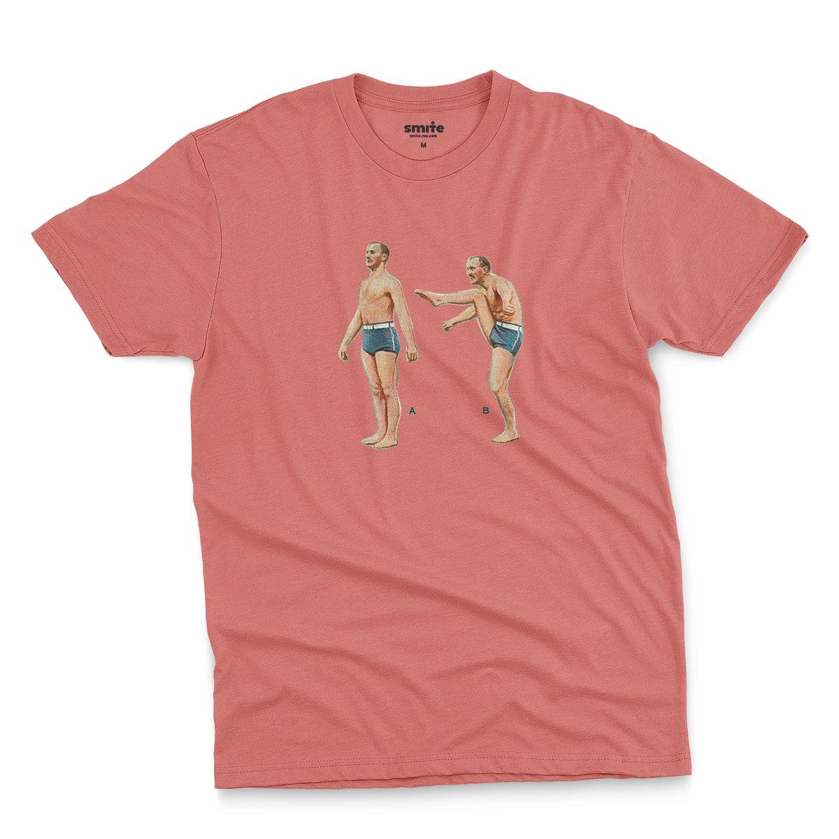A coral pink t-shirt featuring a 1960s vintage graphic of an exercising man in blue swim trunks, labeled A and B.