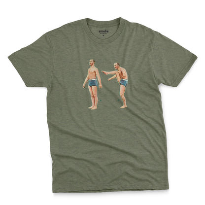 A green t-shirt featuring a 1960s vintage graphic of an exercising man in blue swim trunks, labeled A and B.