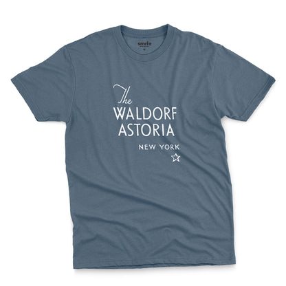 A blue t-shirt with a retro logo for The Waldorf Astoria hotel in New York.