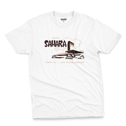 A white t-shirt with a vintage graphic advertising the 'Hotel Sahara' in Las Vegas, Nevada.