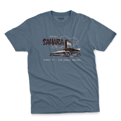 A blue t-shirt with a vintage graphic advertising the 'Hotel Sahara' in Las Vegas, Nevada.