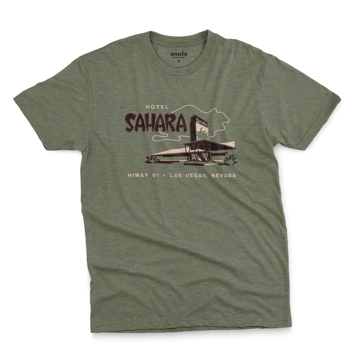 A green t-shirt with a vintage graphic advertising the 'Hotel Sahara' in Las Vegas, Nevada.