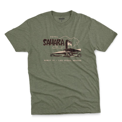 A green t-shirt with a vintage graphic advertising the 'Hotel Sahara' in Las Vegas, Nevada.