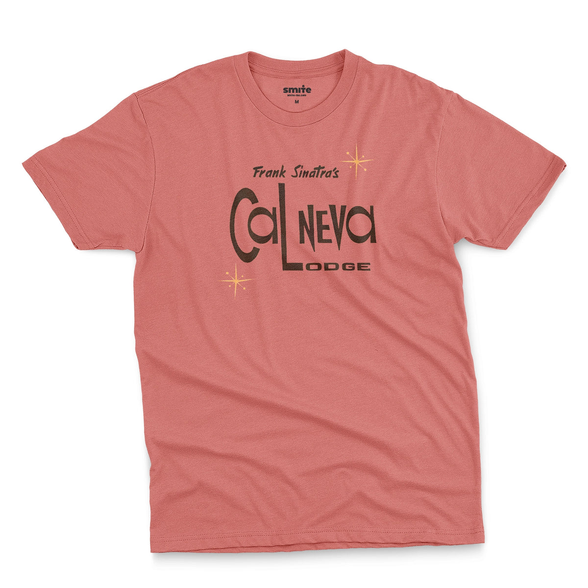 A coral pink t-shirt featuring a retro graphic print of 'Frank Sinatra's Cal Neva Lodge', the legendary hotel and casino.
