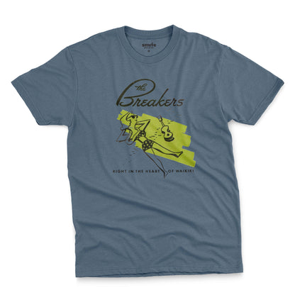 A blue t-shirt featuring a retro illustration of a woman sunbathing, advertising The Breakers, a Hawaiian hotel.