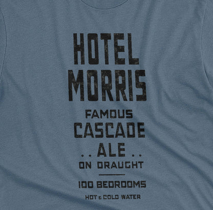 A blue t-shirt with a retro typographic advertisement for 'HOTEL MORRIS' from Sydney, Australia.