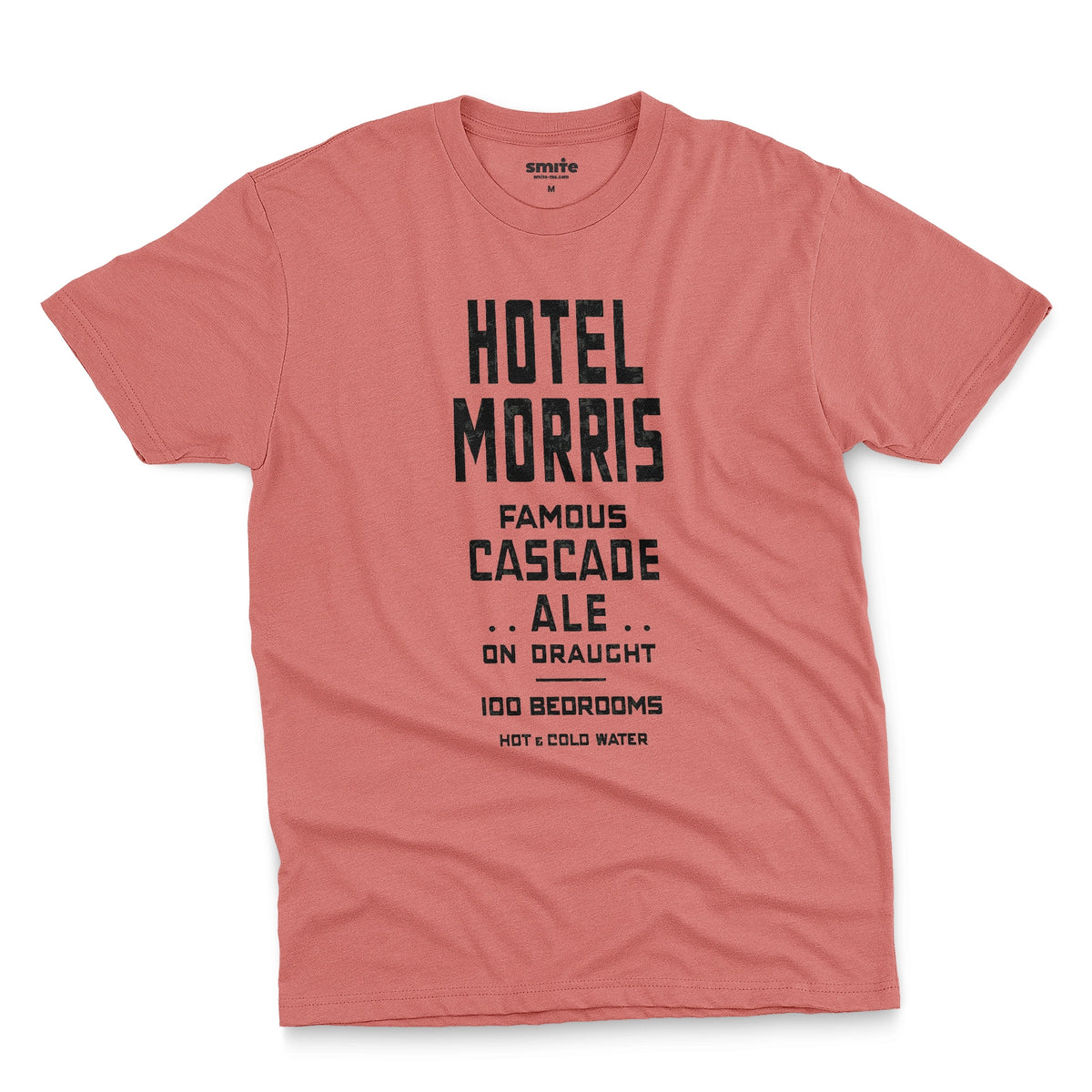 A coral pink t-shirt with a retro typographic advertisement for 'HOTEL MORRIS' from Sydney, Australia.