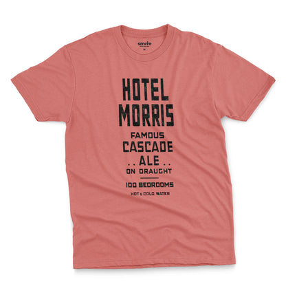 A coral pink t-shirt with a retro typographic advertisement for 'HOTEL MORRIS' from Sydney, Australia.