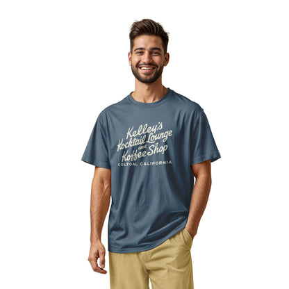 A blue t-shirt with a retro typographic advertisement for Kelley's Kocktail Lounge and Koffee Shop in Colton, California.