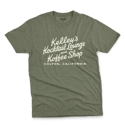 A green t-shirt with a retro typographic advertisement for Kelley's Kocktail Lounge and Koffee Shop in Colton, California.