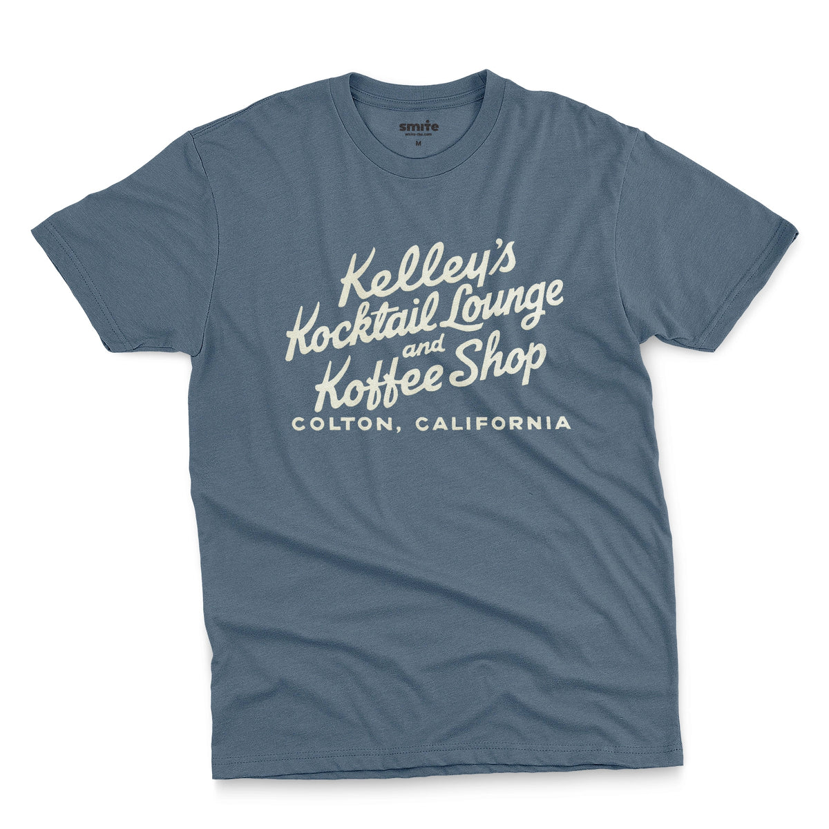A blue t-shirt with a retro typographic advertisement for Kelley's Kocktail Lounge and Koffee Shop in Colton, California.