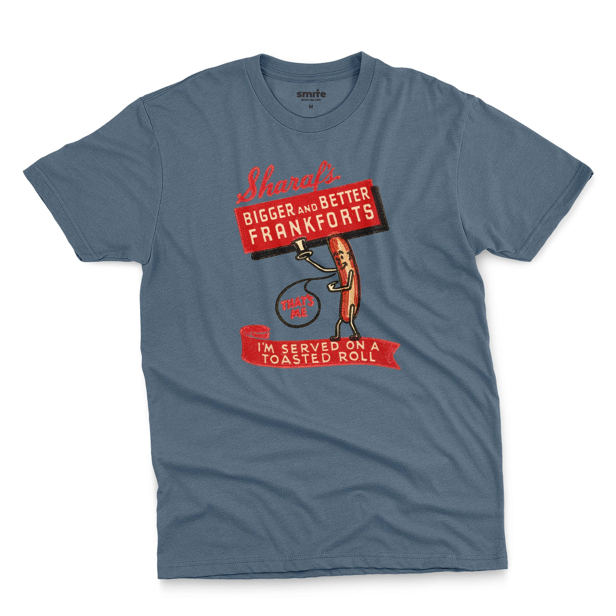 A blue t-shirt with a vintage graphic print of a hot dog character holding a sign that reads 'Sharaf's Bigger and Better Frankforts'.