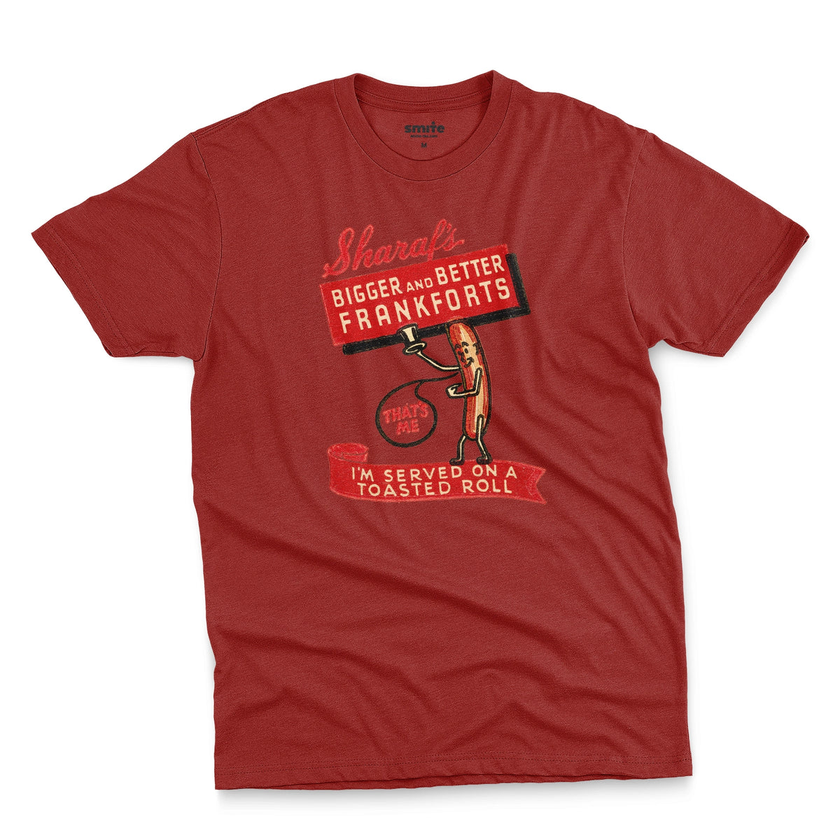 A red t-shirt with a vintage graphic print of a hot dog character holding a sign that reads 'Sharaf's Bigger and Better Frankforts'.