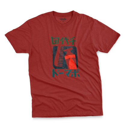 A red t-shirt with a retro Japanese graphic of a comb and toothpaste and Japanese text.