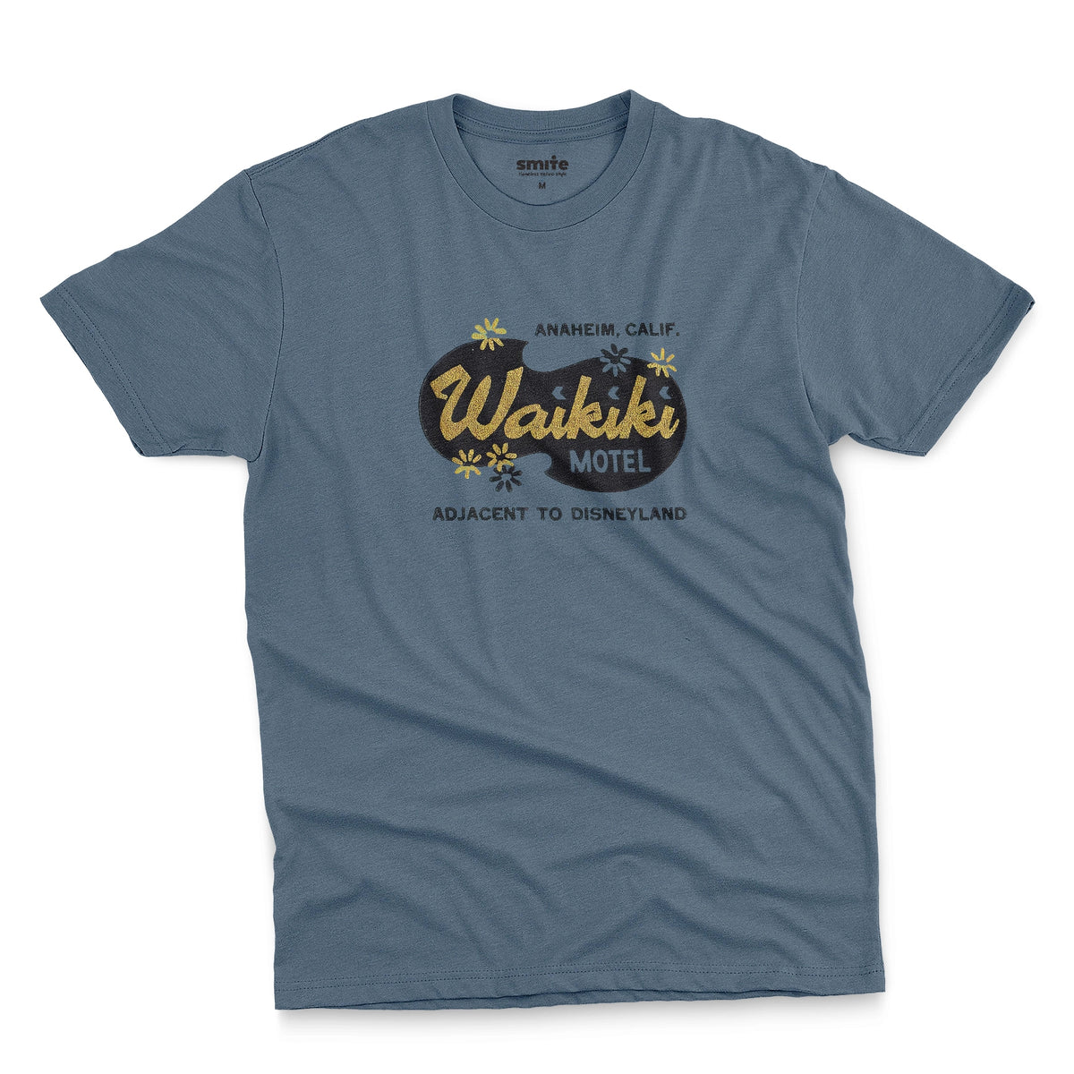 A blue t-shirt with a retro advertisement for the 'Waikiki Motel' in Anaheim, California.