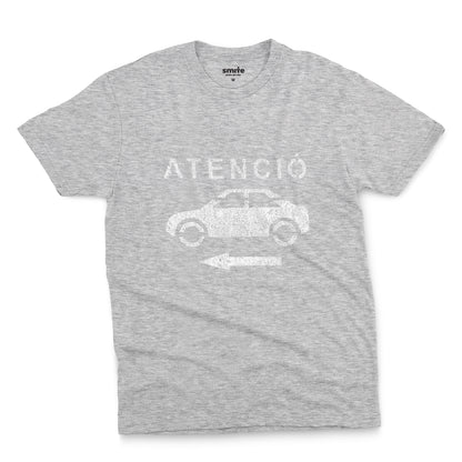 A grey marle t-shirt with a retro white stencil graphic of a car and the Spanish word 'ATENCIÓ'.