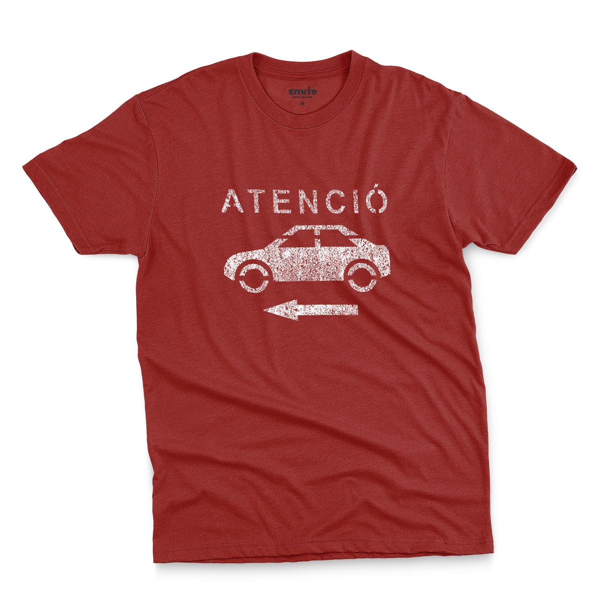 A red t-shirt with a retro white stencil graphic of a car and the Spanish word 'ATENCIÓ'.