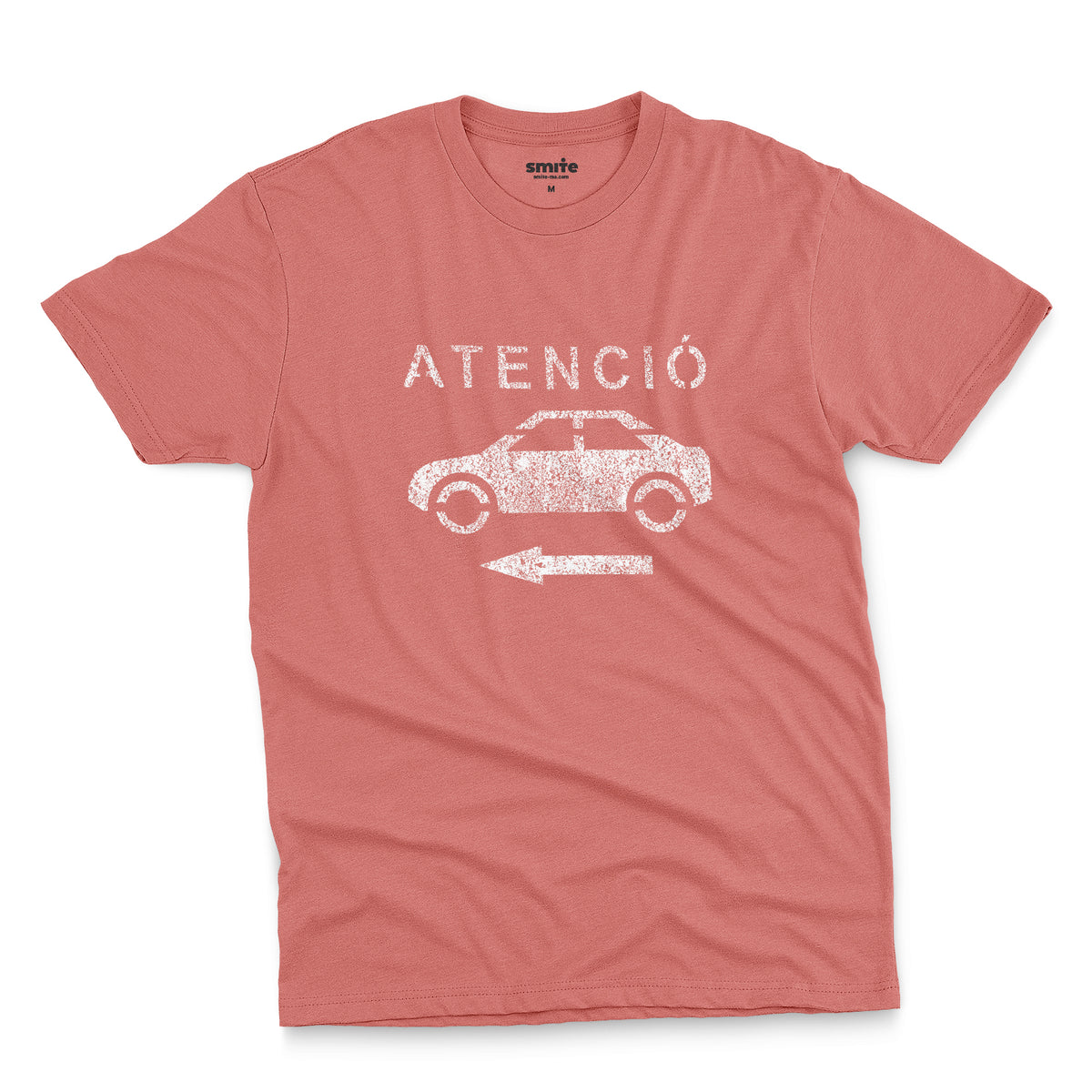 A coral pink t-shirt with a retro white stencil graphic of a car and the Spanish word 'ATENCIÓ'.