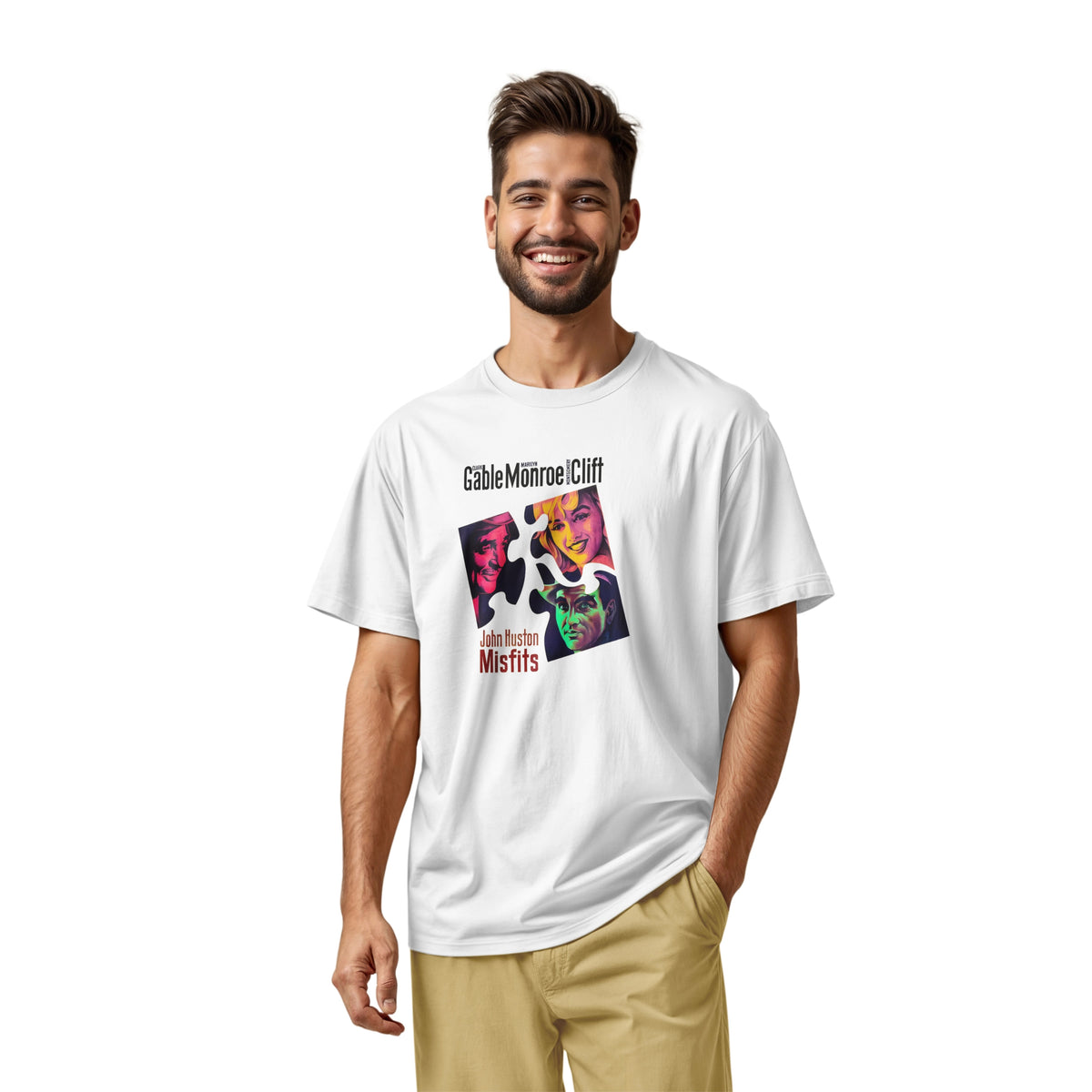 A white t-shirt featuring a colorful graphic advertisement for the movie Misfits starring Clark Gable, Marilyn Monroe, and Montgomery Clift.